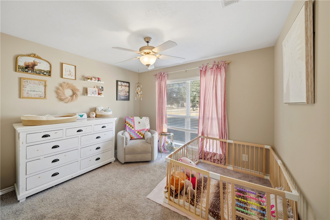 214 Apache Drive Franklin, TX 77856 - Photo 25 of 32 a bedroom with furniture and a window