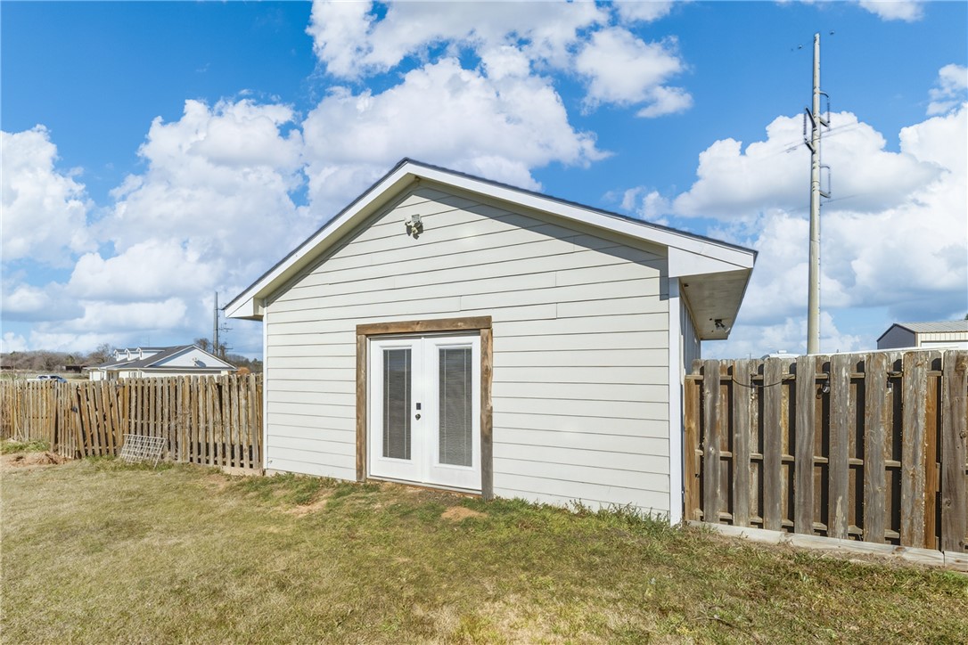 214 Apache Drive Franklin, TX 77856 - Photo 5 of 32 a view of a house with a backyard