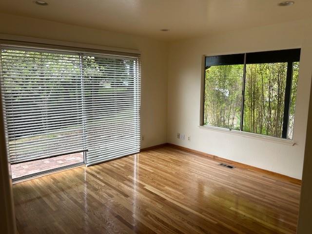 3757 Vienna Drive Aptos, CA 95003 - Photo 6 of 15 a view of an empty room with wooden floor and a window
