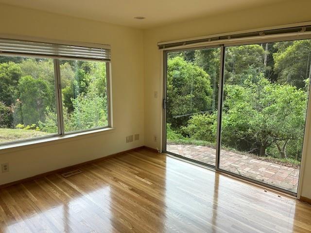3757 Vienna Drive Aptos, CA 95003 - Photo 7 of 15 a view of an empty room with wooden floor and a window