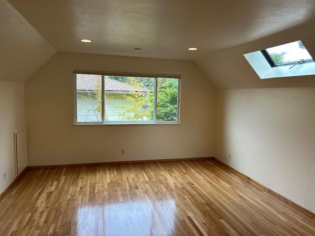 3757 Vienna Drive Aptos, CA 95003 - Photo 10 of 15 an empty room with wooden floor and windows