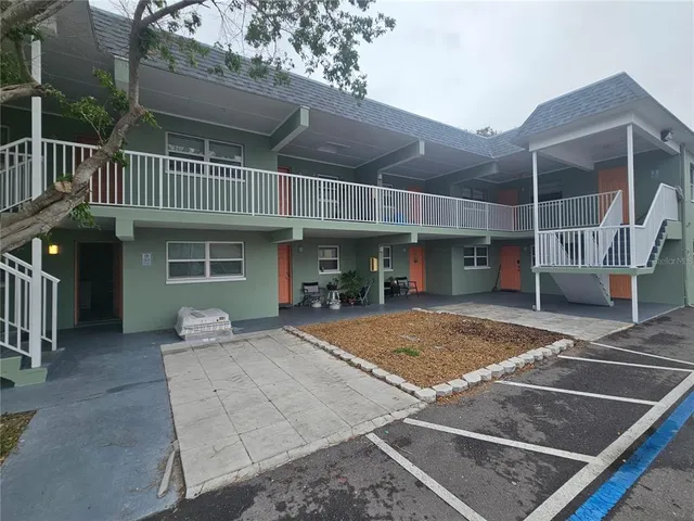 a view of a house with sitting space and balcony