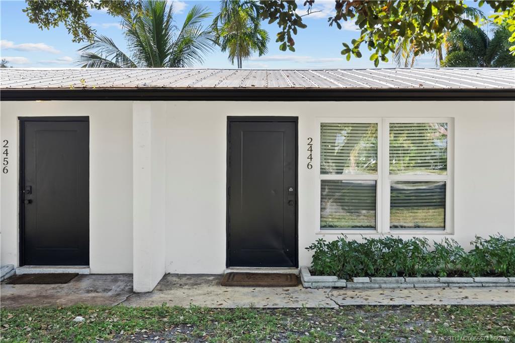 2446 Southwest Hideaway Lane Stuart, FL 34994 - Photo 4 of 12 a front view of a house