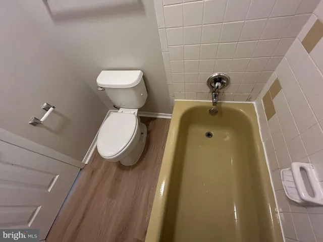 a bathroom with a toilet and a sink