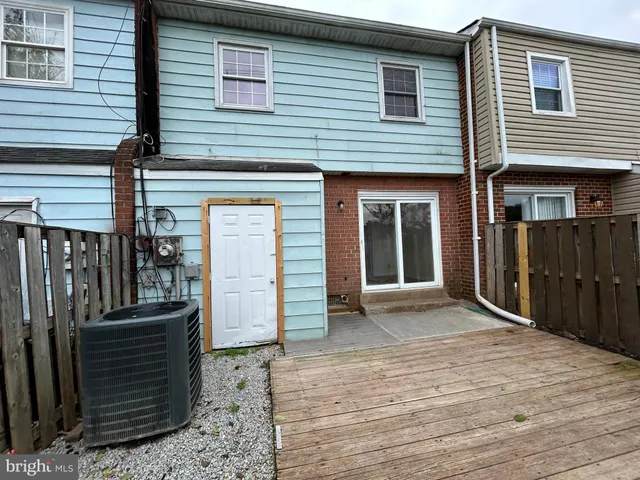 a view of a house with wooden deck