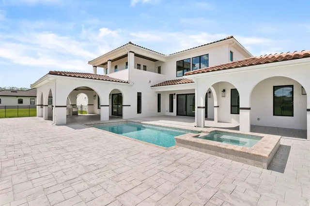 a front view of house with yard outdoor seating and barbeque oven