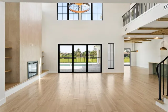a view of an entryway with wooden floor