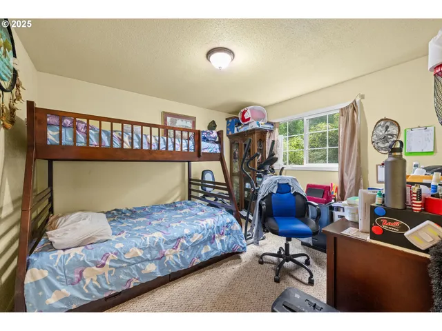 a view of a hallway with wooden floor and entryway
