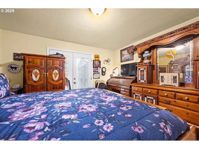 a living room with lots of furniture and clutter