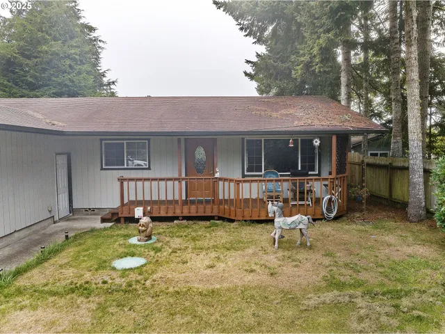 a view of a house with backyard porch and sitting area