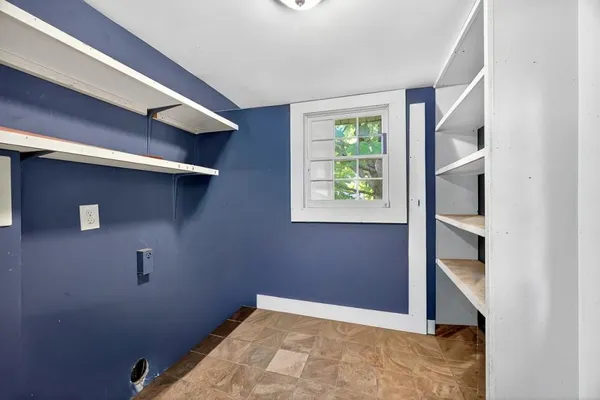 a bathroom with a sink mirror and a shower