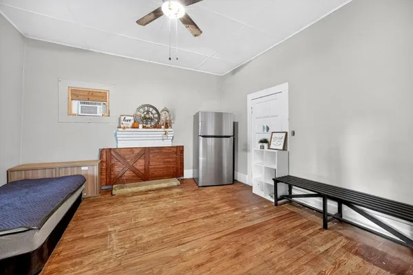 a bedroom with furniture and window