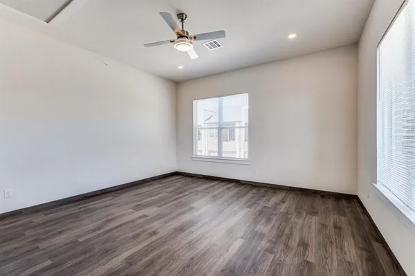 a view of a kitchen with a sink and stainless steel appliances