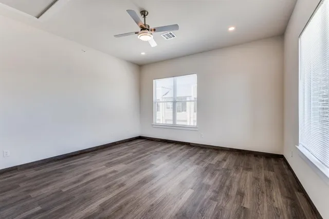 a view of a kitchen with a sink and stainless steel appliances