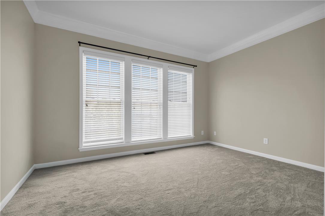 1709 Travers Road Breinigsville, PA 18031 - Photo 21 of 55 A well-lit interior space with a broad window arrangement and soft carpeting.