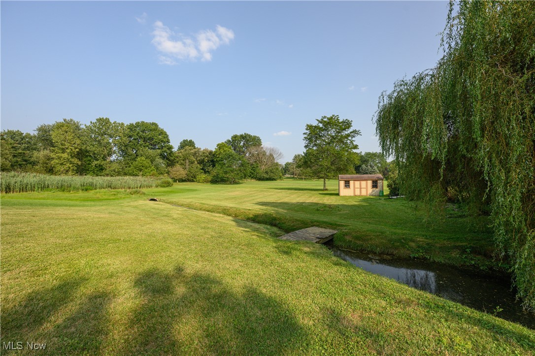6986 Sweetwater Road Northeast Canton, OH 44721 - Photo 29 of 36 View of yard featuring a little creek and an outbuilding
