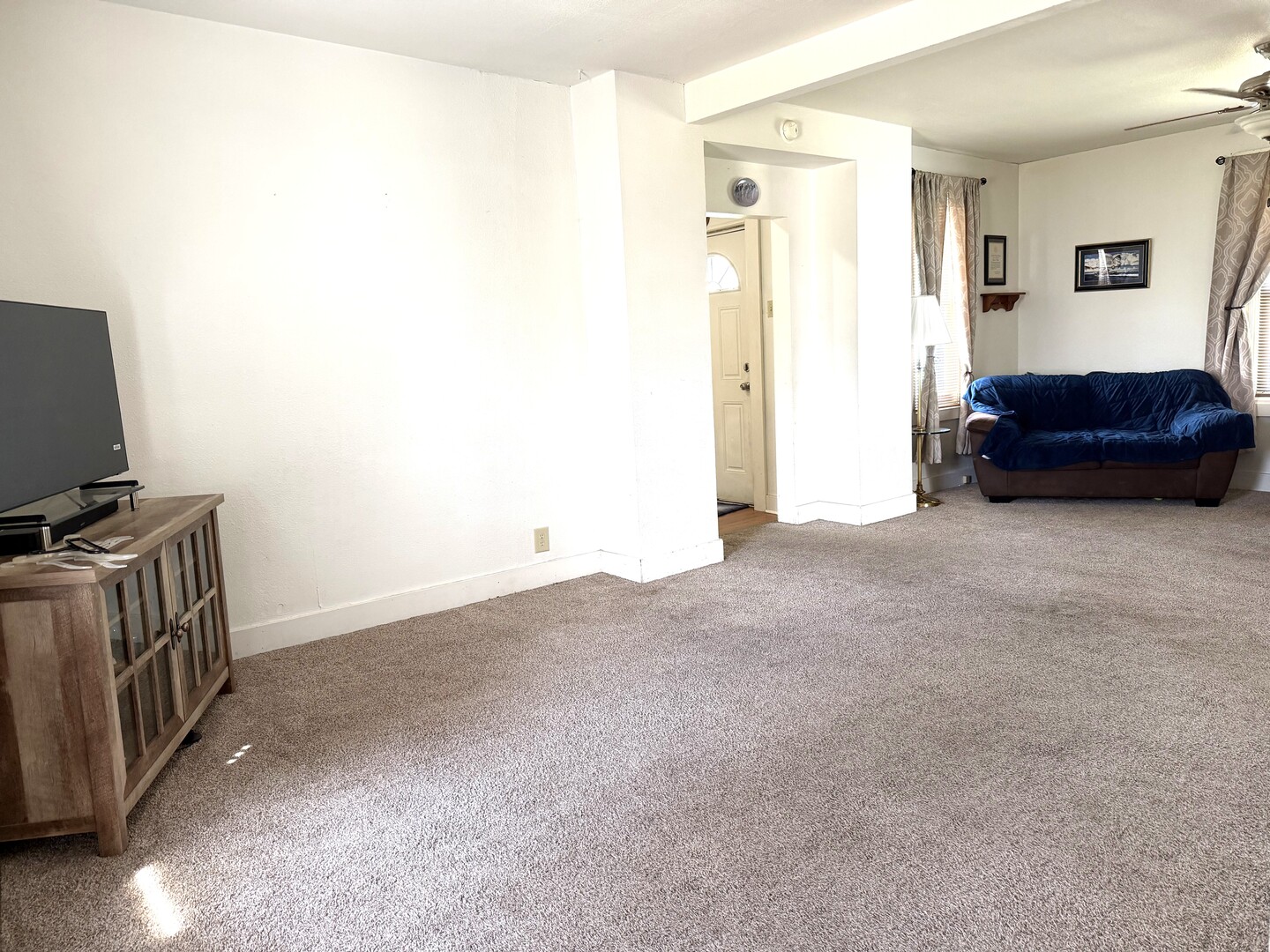 504 11th Avenue Mendota, IL 61342 - Photo 3 of 15 a living room with a couch and a flat screen tv