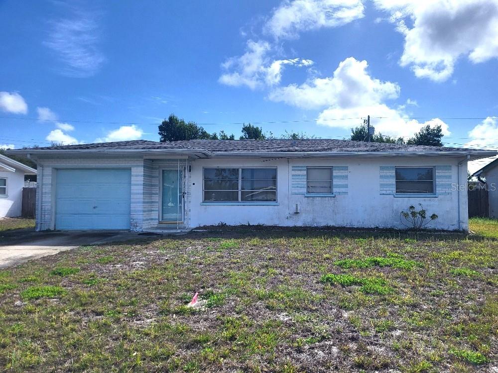 a view of a back yard of the house