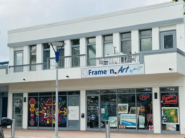 a front view of a building with retail shops