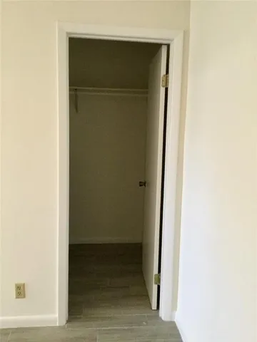 an empty room with windows and entrance