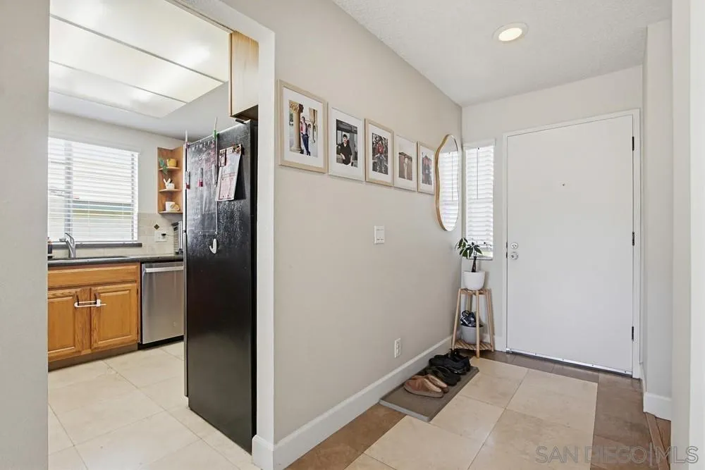 431 Nantucket Escondido, CA 92027 - Photo 12 of 30 a view of a kitchen with a refrigerator cabinet and a window