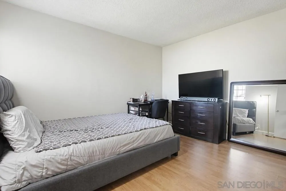 431 Nantucket Escondido, CA 92027 - Photo 19 of 30 a bedroom with a bed and a flat screen tv