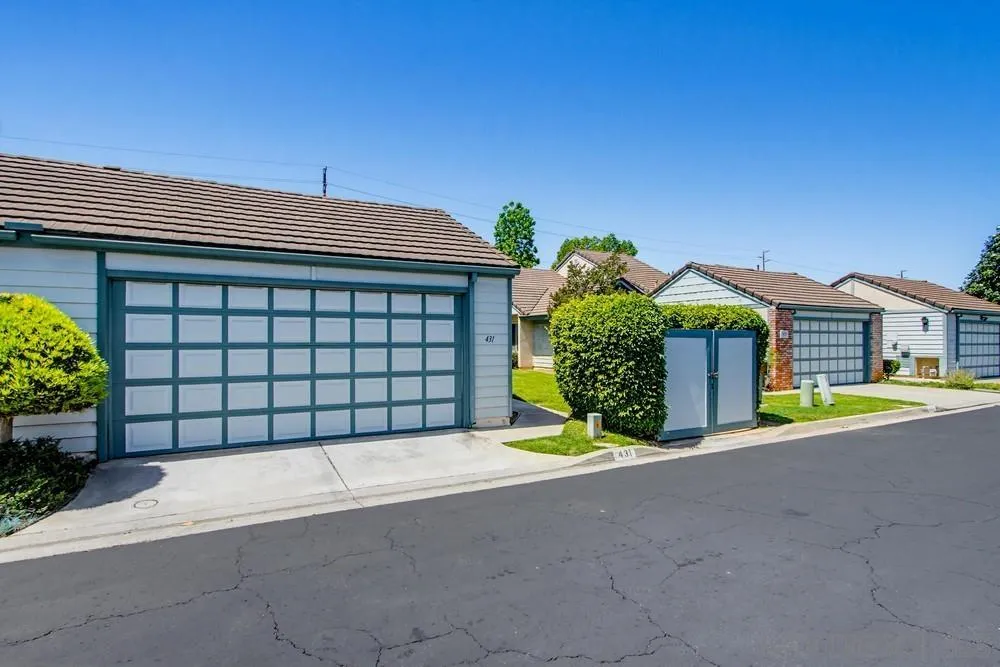 431 Nantucket Escondido, CA 92027 - Photo 2 of 30 a view of a house with a garage and potted plants