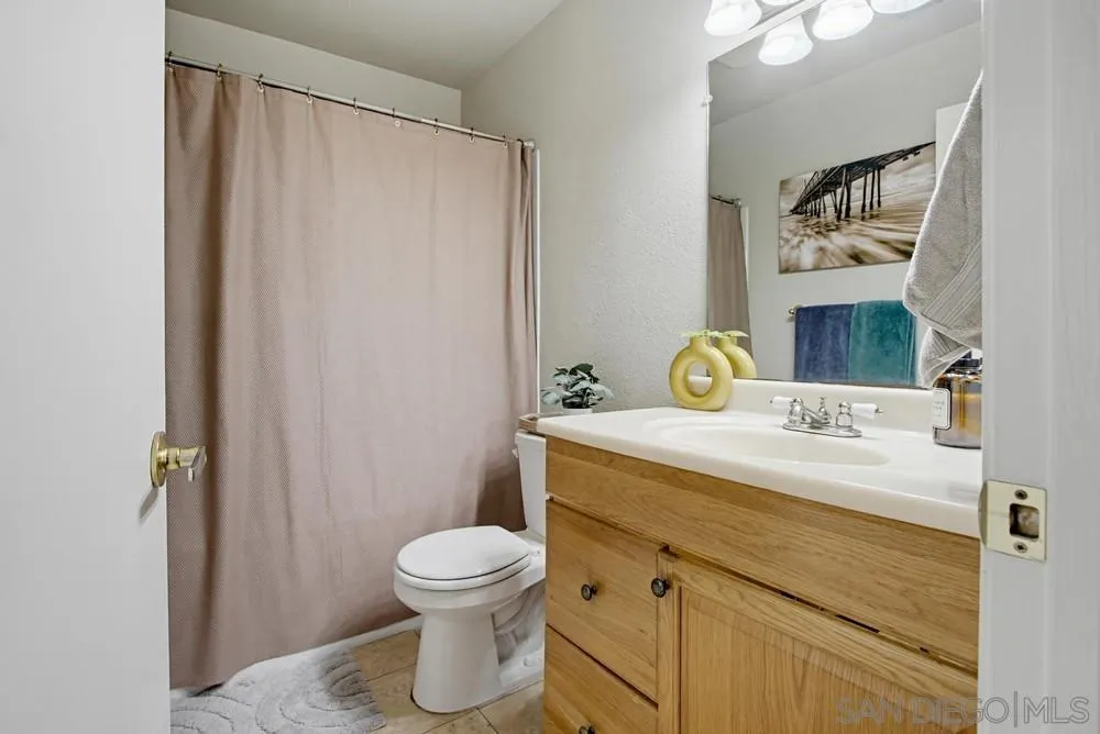 431 Nantucket Escondido, CA 92027 - Photo 21 of 30 a bathroom with a sink toilet and mirror