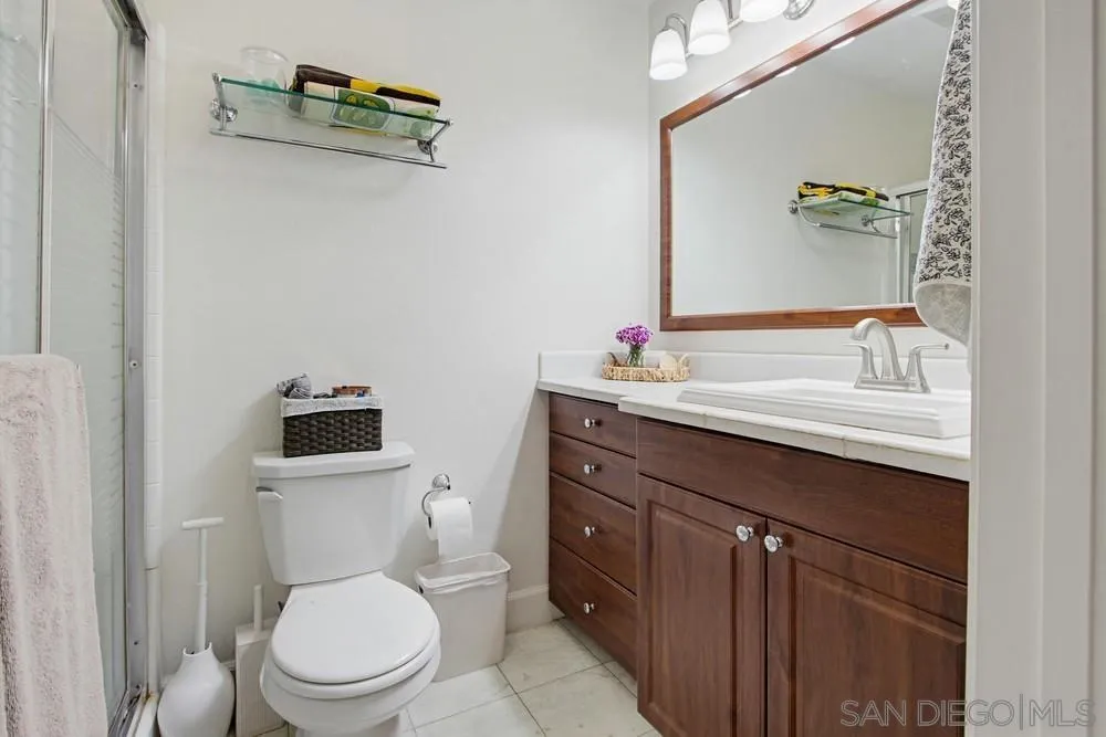 431 Nantucket Escondido, CA 92027 - Photo 23 of 30 a bathroom with a toilet sink vanity and mirror