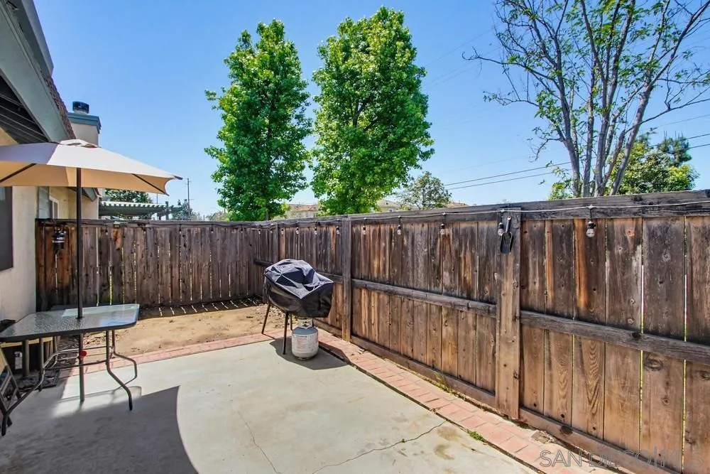 431 Nantucket Escondido, CA 92027 - Photo 27 of 30 a backyard with wooden fence and a lawn chairs