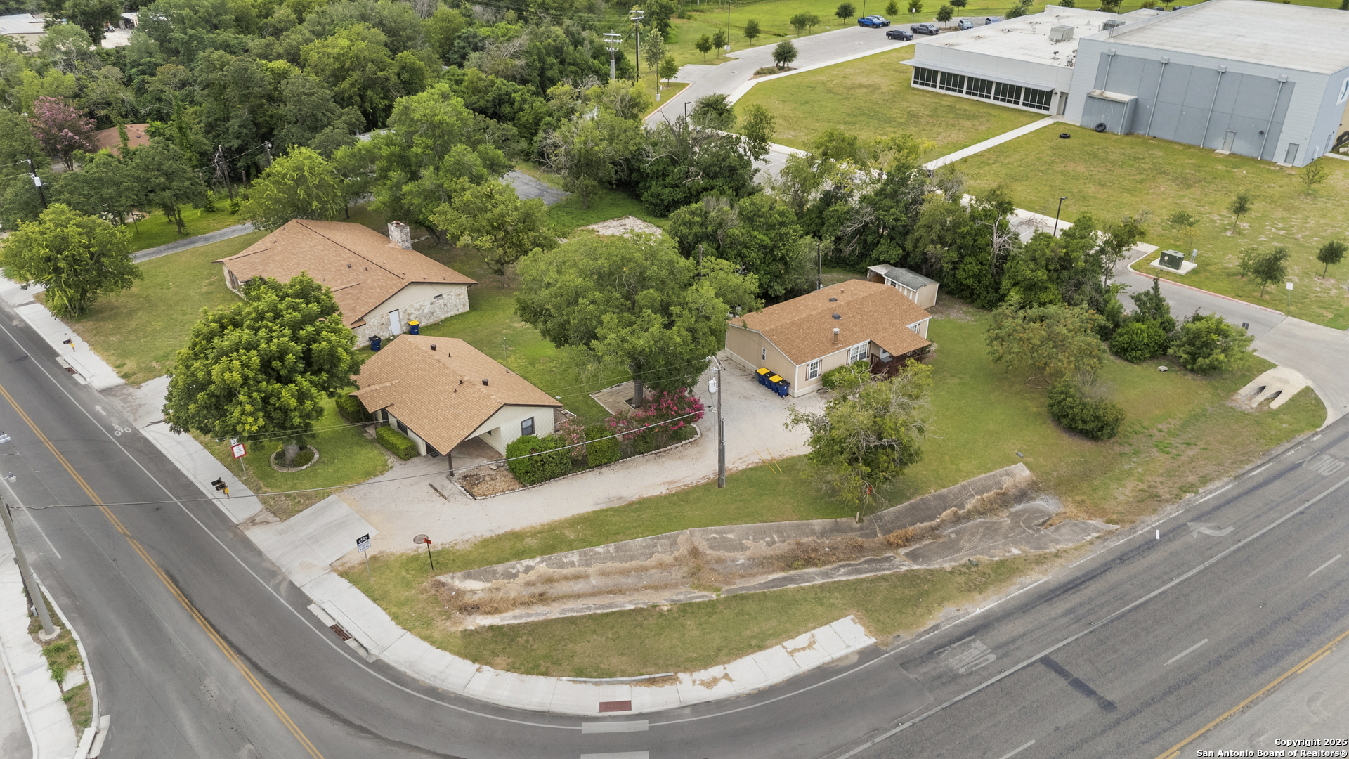 100 Haeckerville Road Cibolo, TX 78108 - Photo 15 of 31 an aerial view of a house with swimming pool and large trees