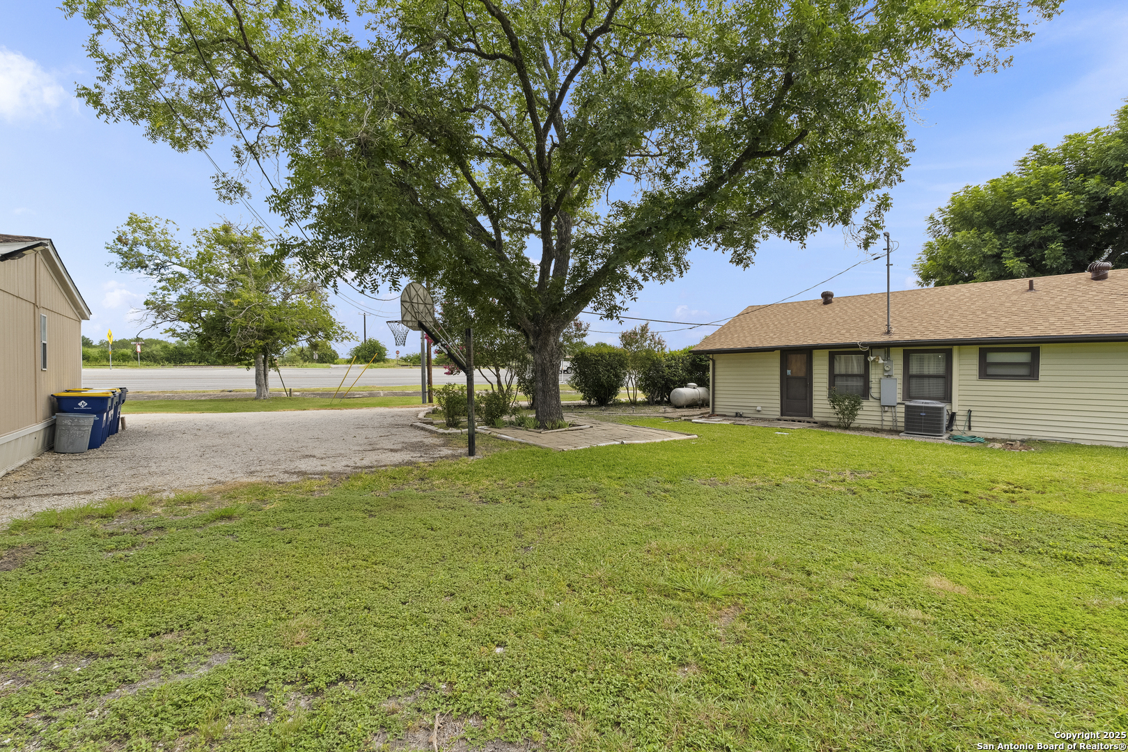 100 Haeckerville Road Cibolo, TX 78108 - Photo 16 of 31 a view of a house with a yard
