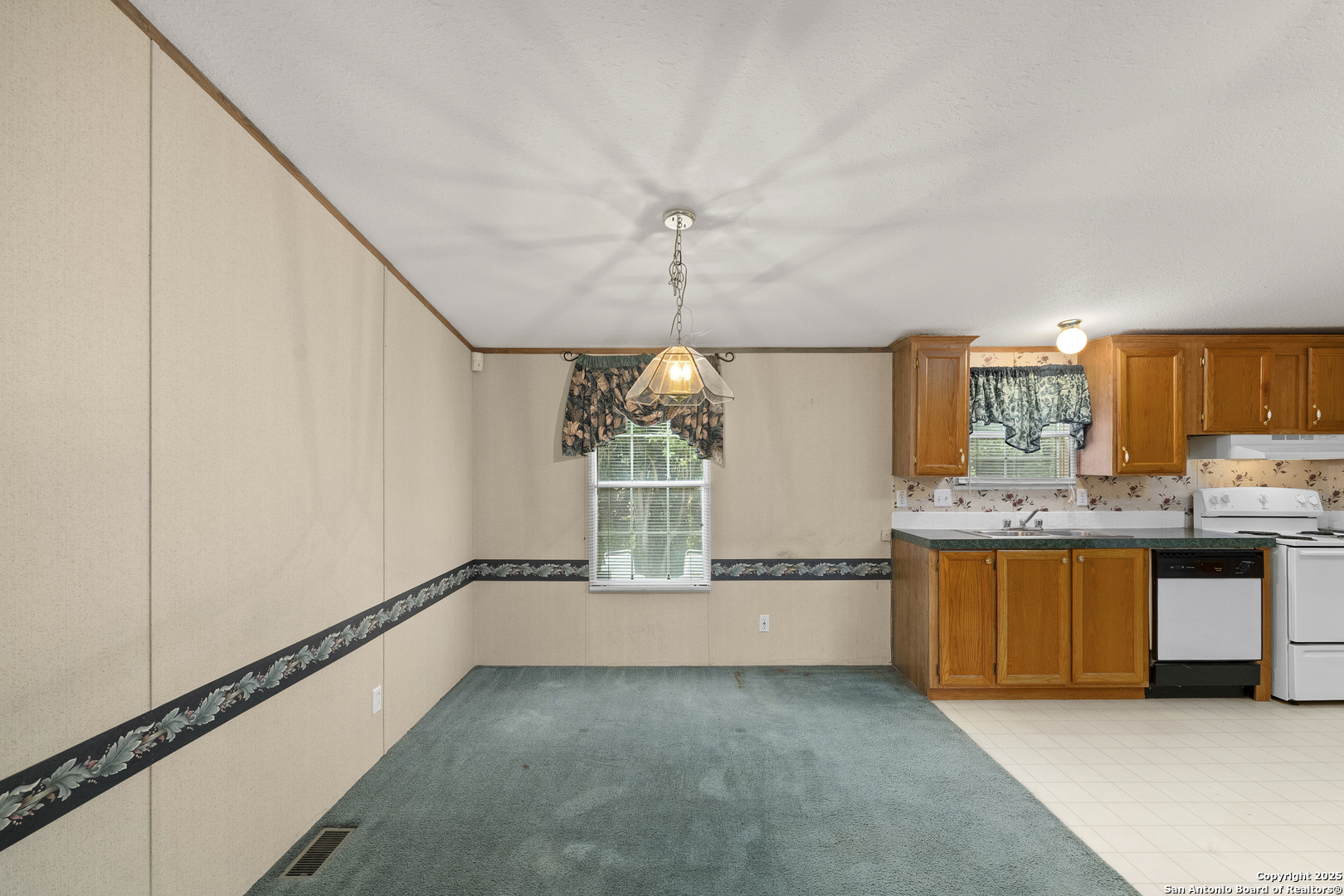 100 Haeckerville Road Cibolo, TX 78108 - Photo 19 of 31 a view of a kitchen with granite countertop cabinets and a sink