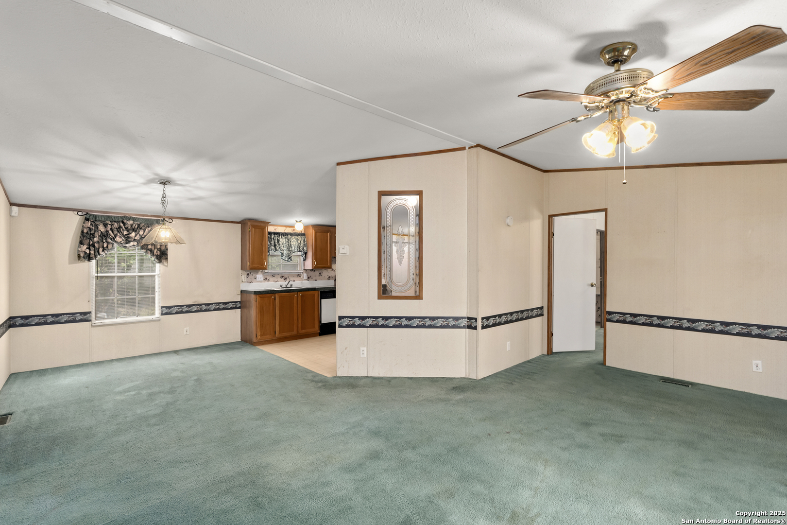 100 Haeckerville Road Cibolo, TX 78108 - Photo 20 of 31 a view of a kitchen with a refrigerator and a chandelier