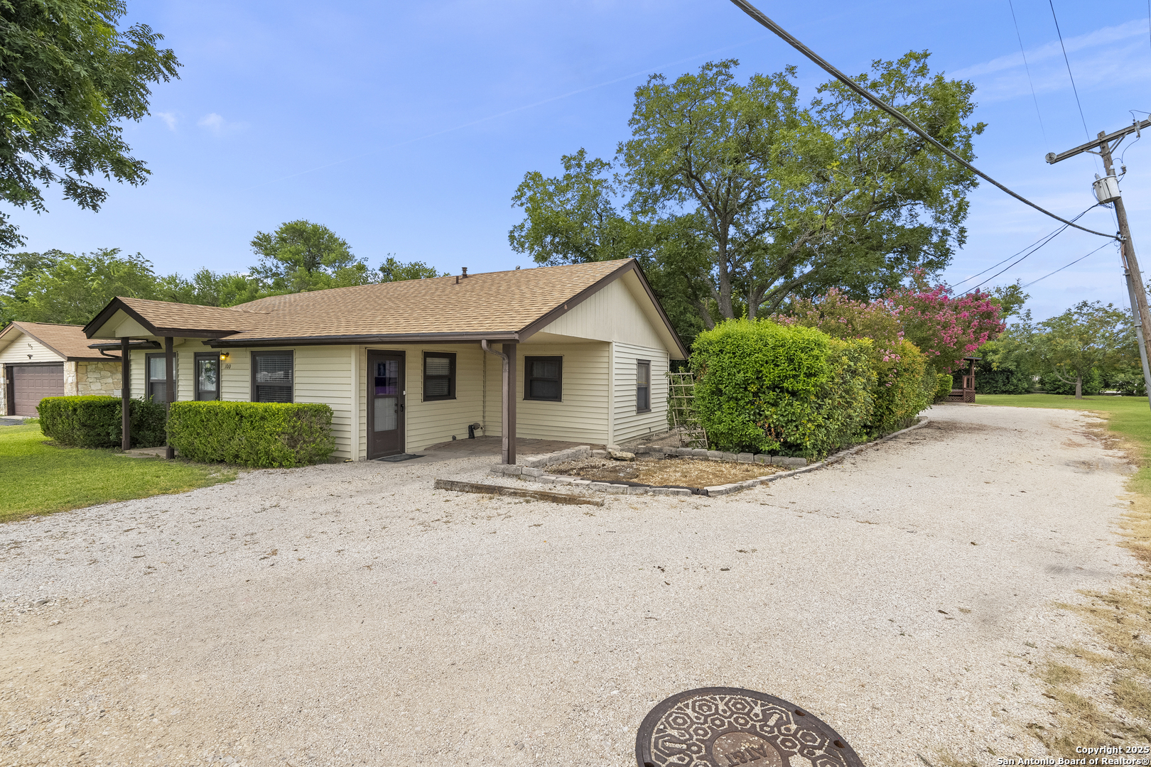 100 Haeckerville Road Cibolo, TX 78108 - Photo 3 of 31 a front view of a house with a yard and garage