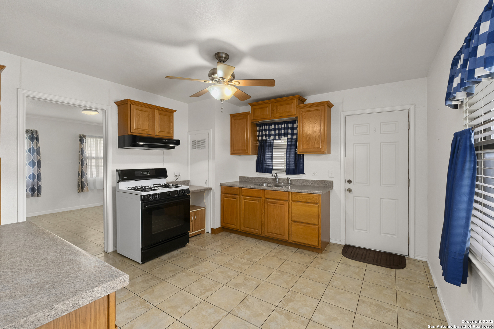 100 Haeckerville Road Cibolo, TX 78108 - Photo 4 of 31 a kitchen with stainless steel appliances granite countertop a stove a sink and a refrigerator