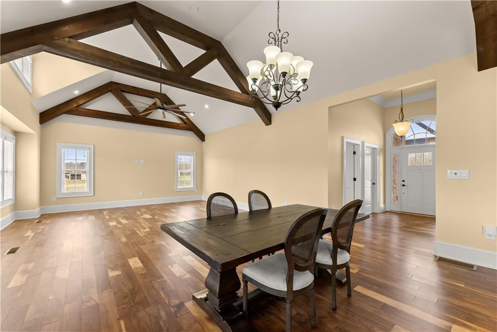 725 County Farm Road Jefferson, GA 30549 - Photo 16 of 66 a view of a dining room with furniture and chandelier