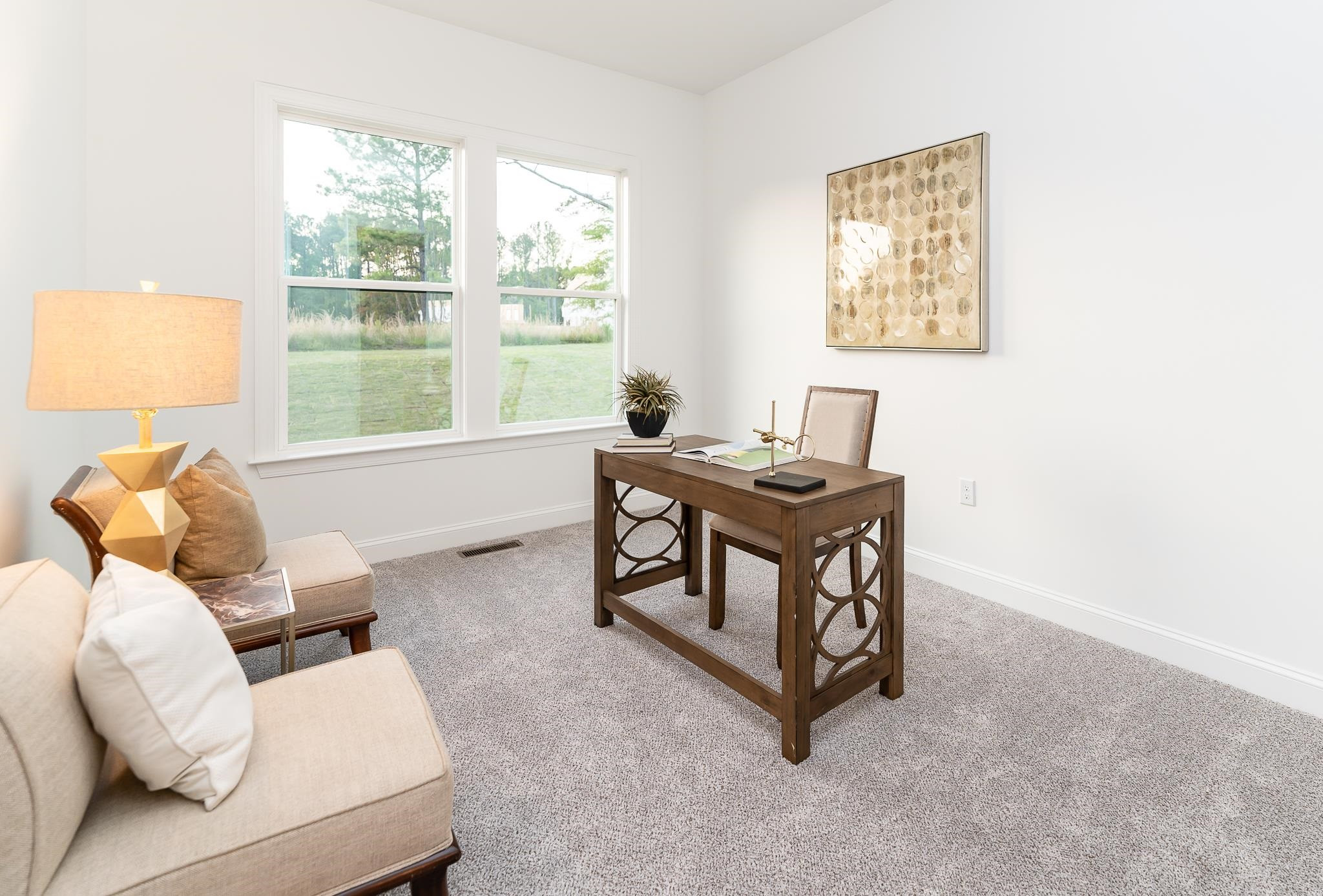 7640 Hasentree Way Wake Forest, NC 27587 - Photo 24 of 40 a living room with furniture and a window