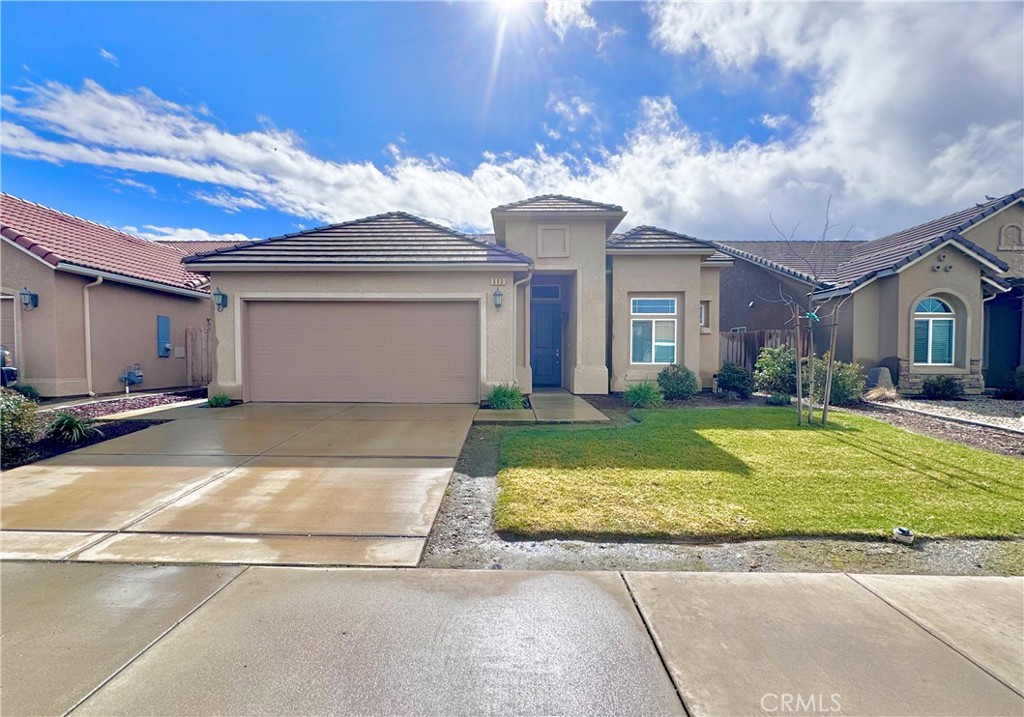 440 Hart Drive Merced, CA 95348 - Photo 1 of 1 a view of a white house with a swimming pool and a yard