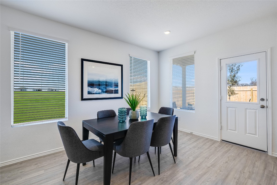 104 Stumpy Street San Marcos, TX 78666 - Photo 15 of 23 a view of a dining room with furniture window and wooden floor