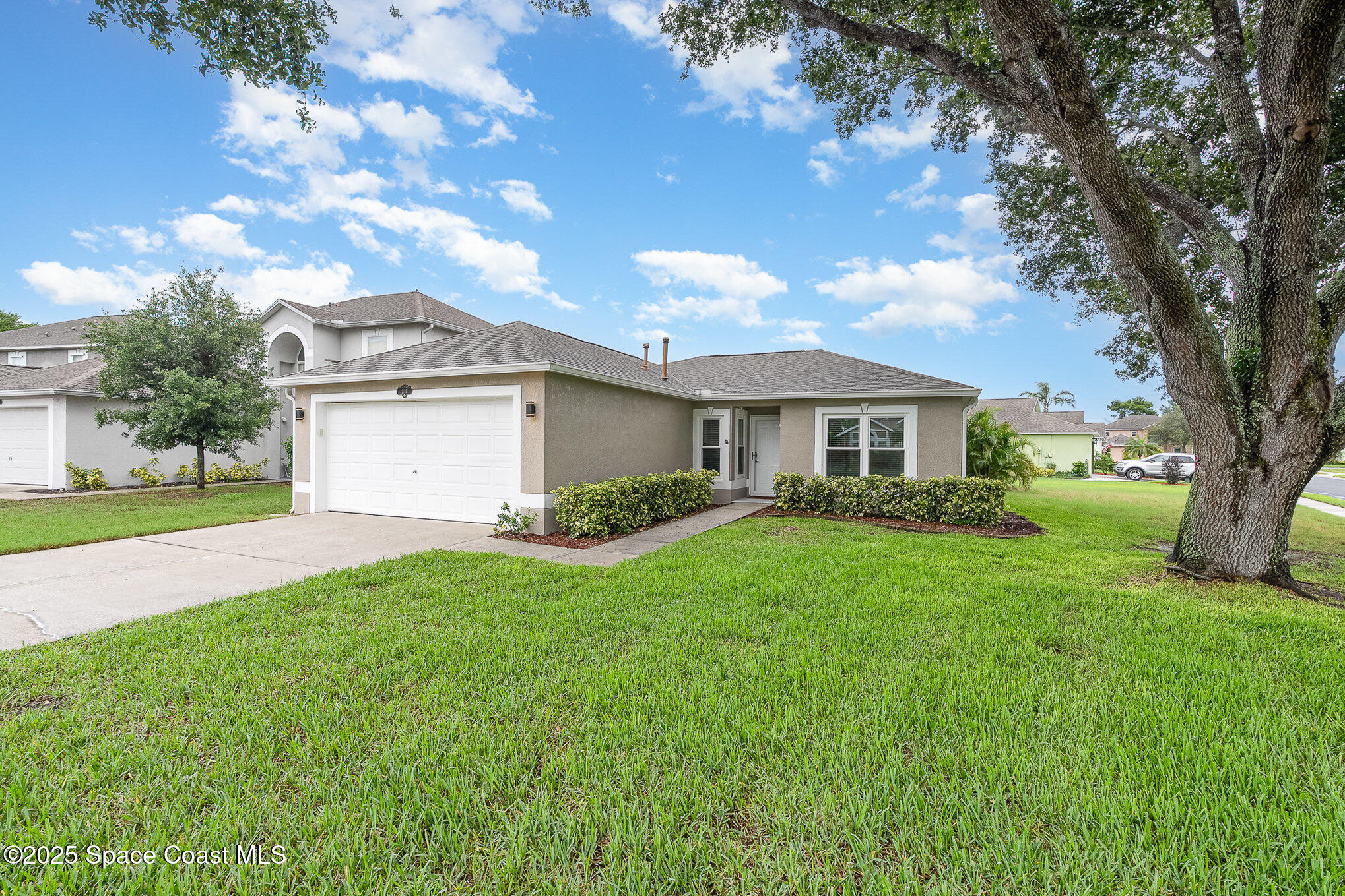 2111 Spring Creek Circle Palm Bay, FL 32905 - Photo 2 of 32 Front Side of Home