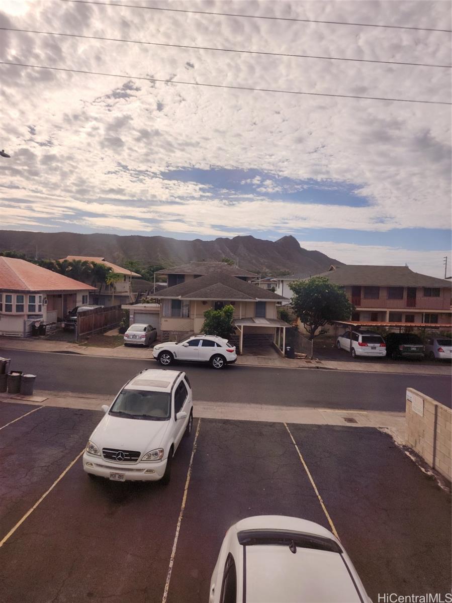 a view of a city street with cars