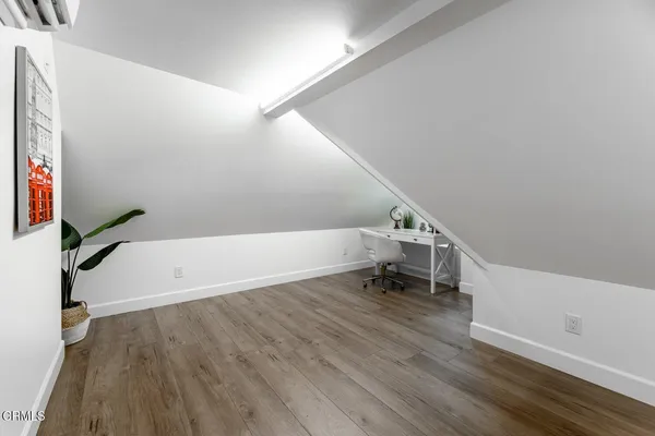 a view of entryway with stairs and wooden floor