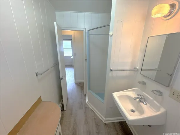 a white toilet sitting next to a bathroom sink