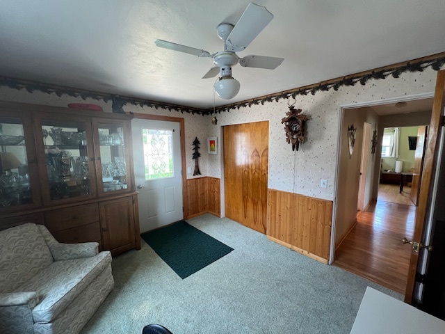 211 Koch Drive Genoa, IL 60135 - Photo 17 of 29 a living room with furniture and a chandelier