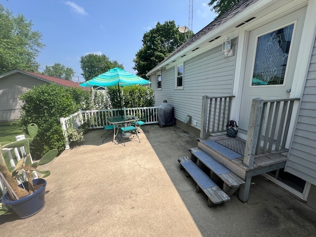 211 Koch Drive Genoa, IL 60135 - Photo 25 of 29 a view of backyard with deck and outdoor seating