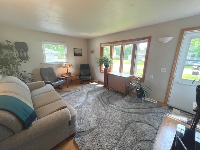 211 Koch Drive Genoa, IL 60135 - Photo 5 of 29 a living room with furniture or couch and a window