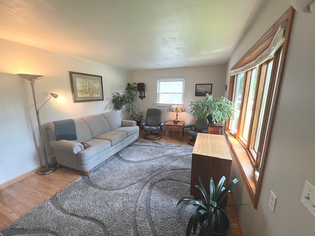 211 Koch Drive Genoa, IL 60135 - Photo 7 of 29 a living room with furniture and a large window