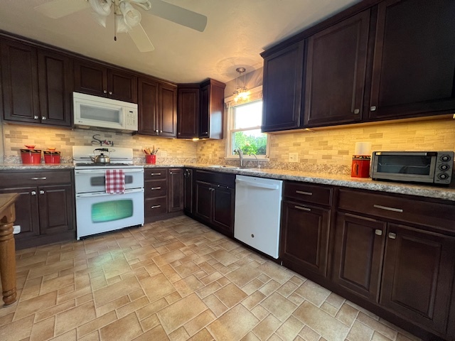 211 Koch Drive Genoa, IL 60135 - Photo 9 of 29 a kitchen with lots of counter top space sink and cabinets