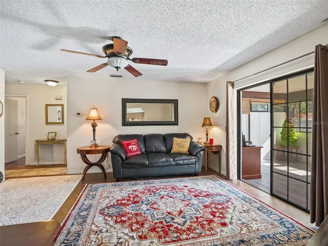 a living room with furniture and a rug